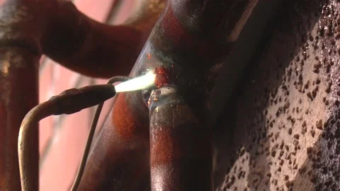 Working welder at the factory in a protective Stock Footage 153490289