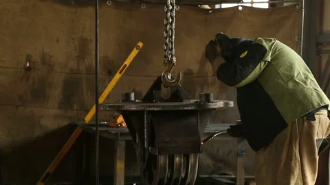 Working welder welds the part Stock Footage 146371740