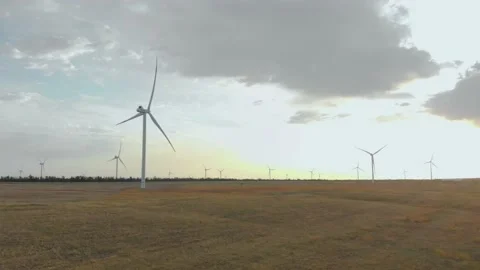 Working wind turbines at dawn 4K Video stock 207808307