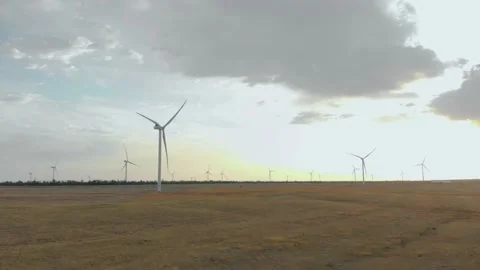 Working wind turbines in the field 4K Stock Footage 207808249
