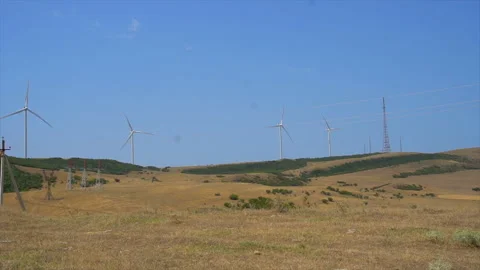 Working windmills in the fields of Georgia, Energy Production - Clean and Stock Footage 94134756