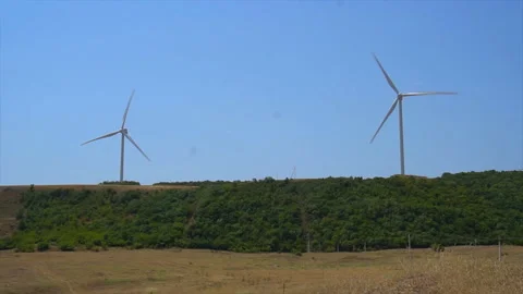 Working windmills in the fields of Georgia, Energy Production - Clean and Stock-Footage 94134927