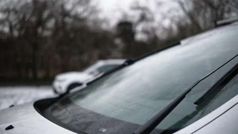 Working Windscreen Wipers With Falling Snow Stock Footage 329226857