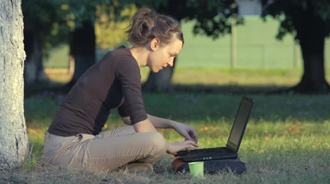 Working wireless in the park Stock Footage 30457218