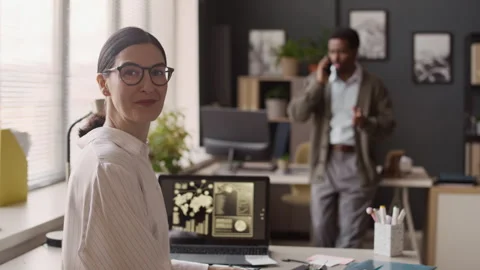 Working Woman Posing for Camera while in Office Stock Footage 323443888
