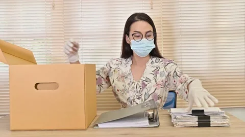 Working woman storing documents in Brown Carton Cardboard box Stock Footage 136530866