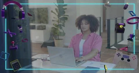 Working woman typing on silver laptop at office, wearing pink shirt, wristwatch, Stock Photos