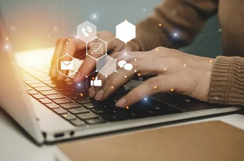 Working woman using laptop computer on desk at home office Stock Photos
