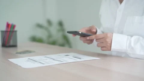 Working woman using a mobile phone scan barcode and QR code. Save time and sa 動画素材 217953786