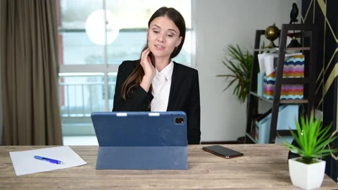 Working women are using computers and the phone to talk about work in office. Stock Footage 139159868