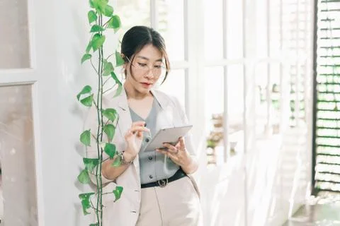Working women using tablet in the cafe Stock Photos