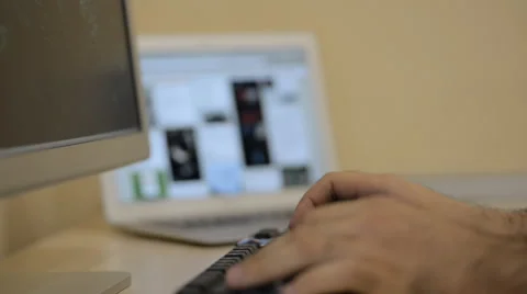 Working at Wood Desk at computer and Modern devices Dual Monitor Vidéo 56554550