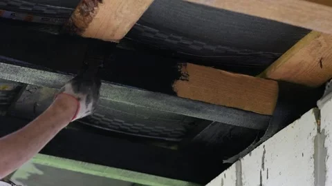 Working with wooden beams, preparing and painting wood for construction Stock Footage 274650910