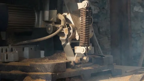 Working woodworking machine covered with dust and fine sawdust and smoking under Stock Footage 332875969