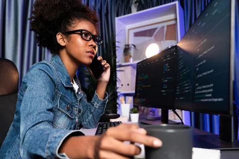 Working young African IT developer smartphone calling with friend. Tastemaker. Stock Photos
