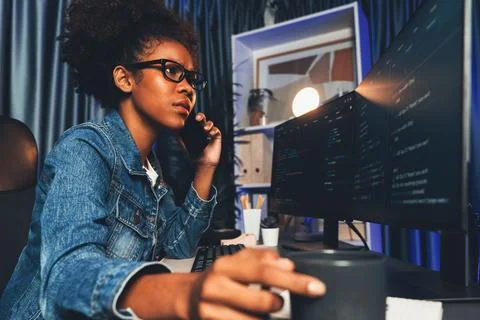 Working young African IT developer smartphone calling with friend. Tastemaker. 스톡 사진