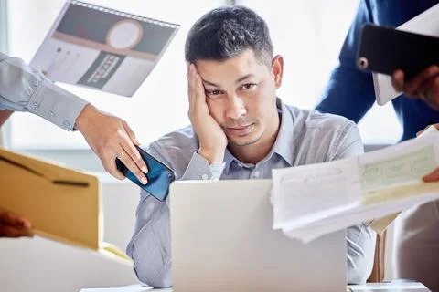 The workload just doesnt end. a young businessman looking stressed out in a Stock Photos