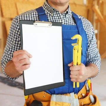 Workman with blank document Stock Photos