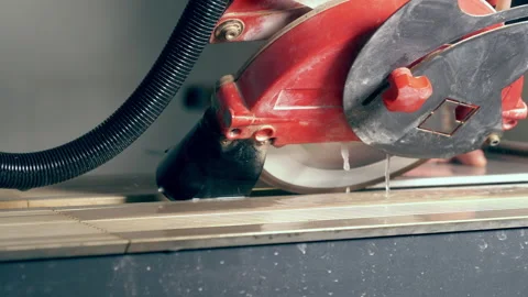 Workman carefully cutting an edge on a wall tile Stock Footage 142105518