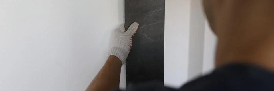 Workman choosing texture for wall Stock Photos