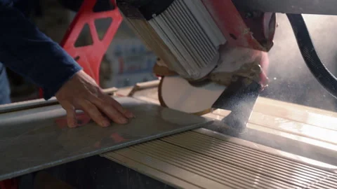 Workman cutting a panel or tile with circular saw Video stock 142105826