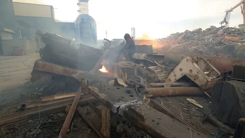Workman cutting scrap metal with open fire Stock Footage 72713460