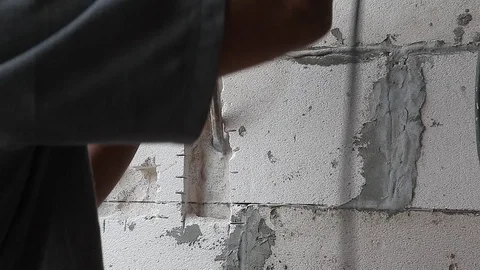Workman drill the wall in a construction site Stock Footage 90603918