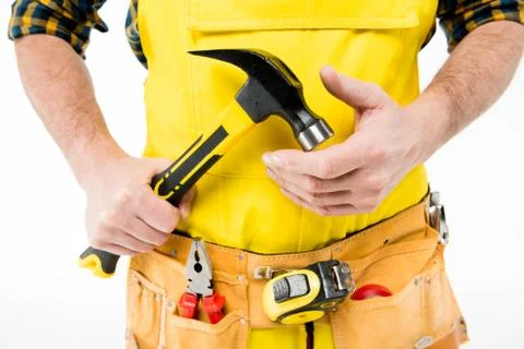 Workman holding hammer Stock Photos