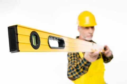 Workman with level tool Stock Photos