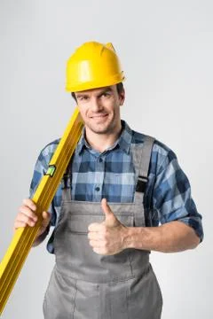 Workman with level tool Stock Photos