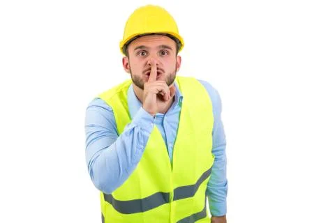 Workman making silence gesture over isolated white background Foto stock