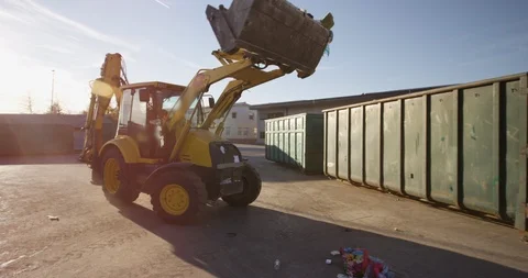 Workman Moving Trash Into Recycling Bins Stock Footage 125363822