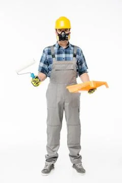 Workman with paint roller Stock Photos