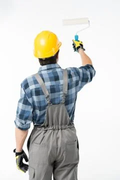 Workman with paint roller Stock Photos