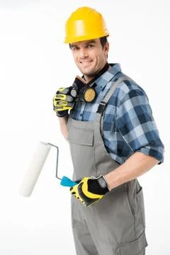 Workman with paint roller Stock Photos