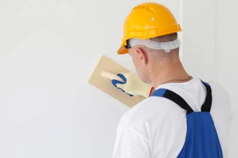Workman polishing wall Stock Photos