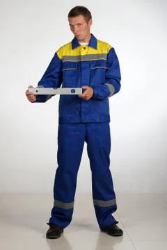 Workman  posing in overalls. Stock Photos