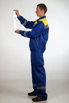 Workman  posing in overalls. Foto stock