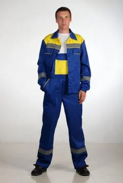 Workman  posing in overalls. Stock Photos