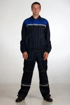 Workman  posing in overalls. Stock Photos