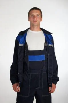 Workman  posing in overalls. Stock Photos