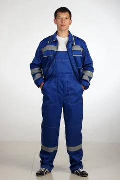 Workman  posing in overalls. Stock Photos