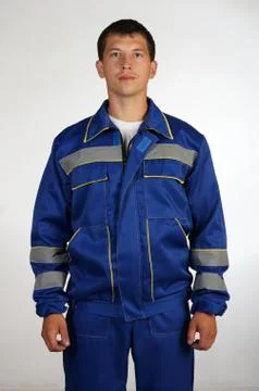 Workman  posing in overalls. Stock Photos