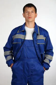 Workman  posing in overalls. Stock-Fotos