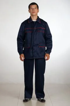 Workman  posing in overalls. Stock-Fotos