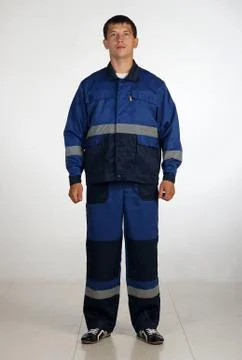Workman  posing in overalls. Stock Photos