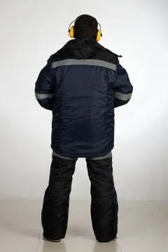 Workman  posing in overalls. 스톡 사진