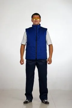 Workman  posing in overalls. Stock-Fotos