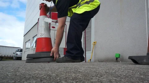 Workman prepares site for roadworks Stock Footage 42140387
