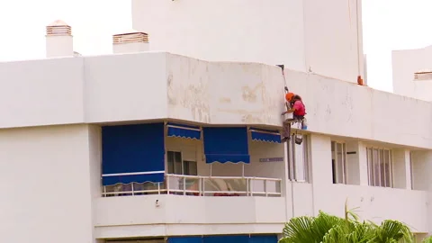 Workman preparing building for painting Stock Footage 160818260